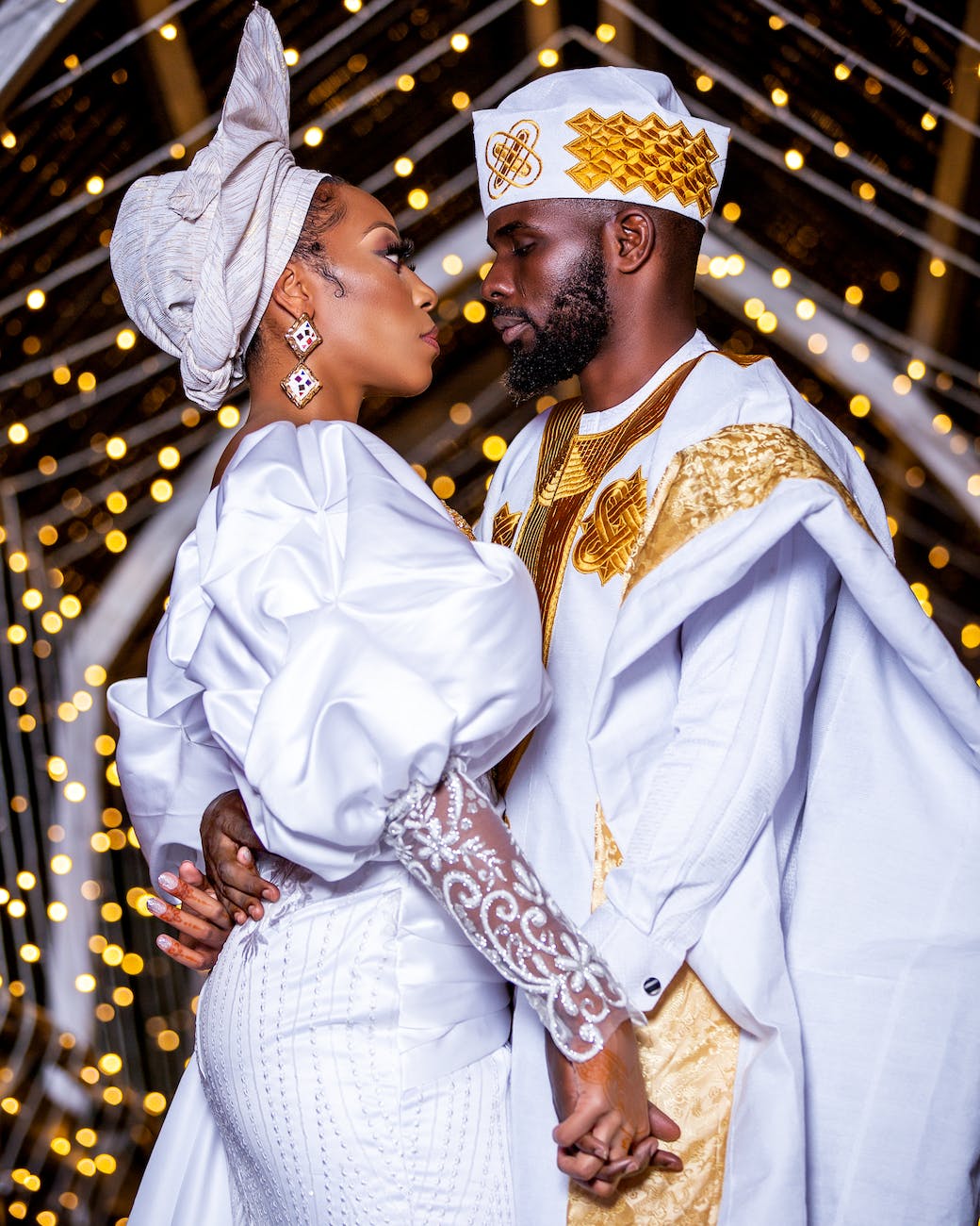 a bride and groom wearing traditional wedding clothes